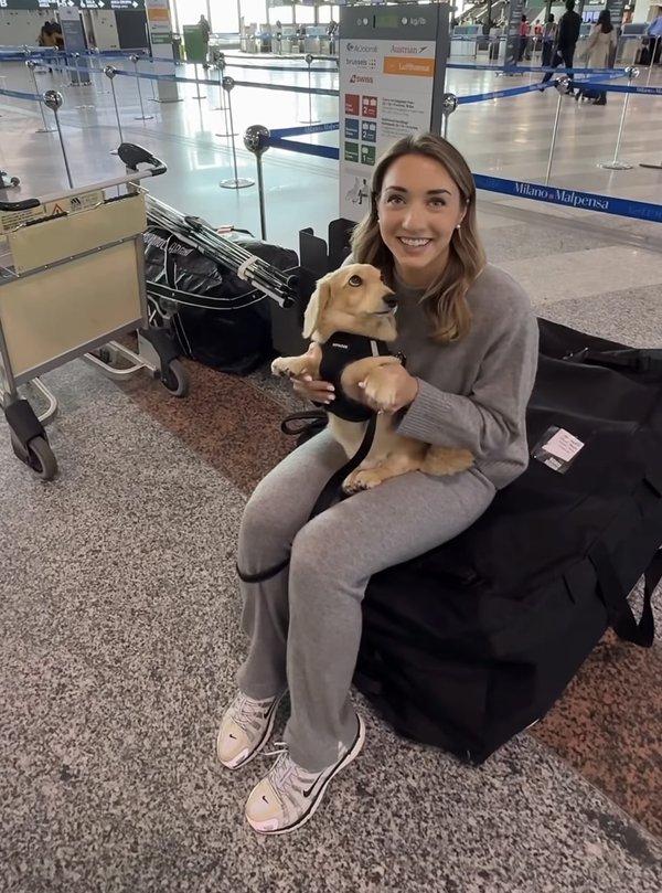 Client and dog ready to board at the terminal