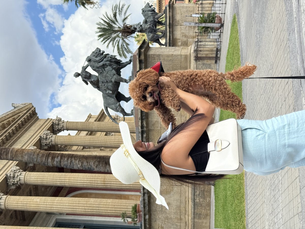 Gaby holding Cotufa at a European monument, showing the freedom of traveling together